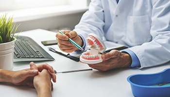 A dentist and patient discussing a dental treatment