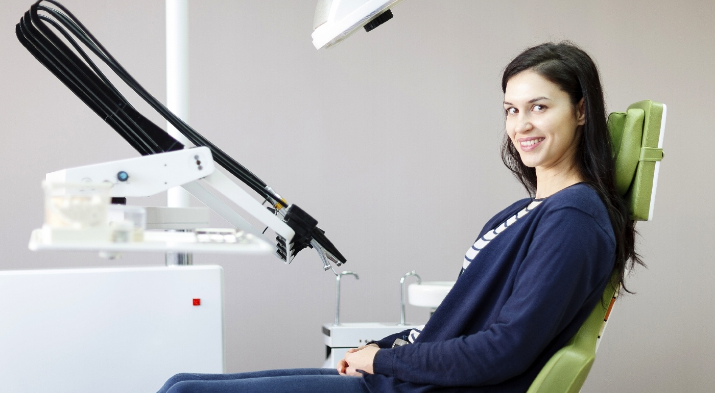 Woman in dental chair smiling