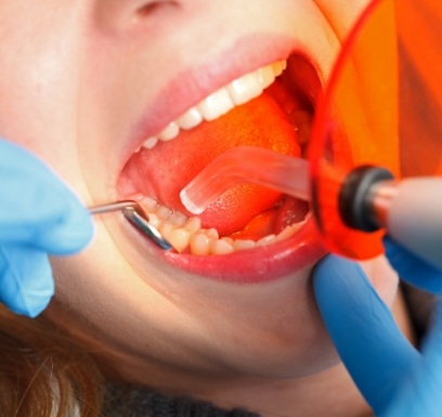 Dentistry patient receiving cosmetic dental bonding