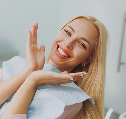 Happy dental patient in treatment chair