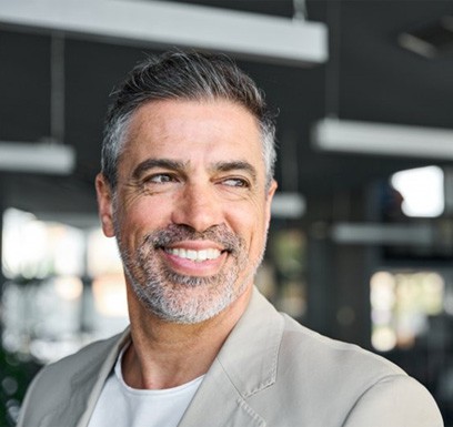 a man in a professional suit smiling