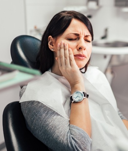 Woman in pain before emergency dentistry