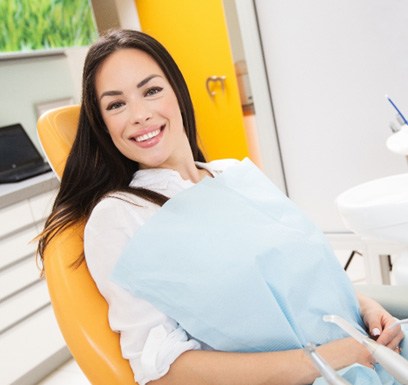 Female patient visiting emergency dentist in Tulsa, OK