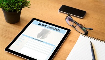 Dental insurance form on a tablet on a desk