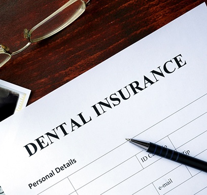 dental insurance form on table