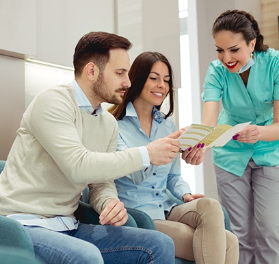 dental professional talking to patients 