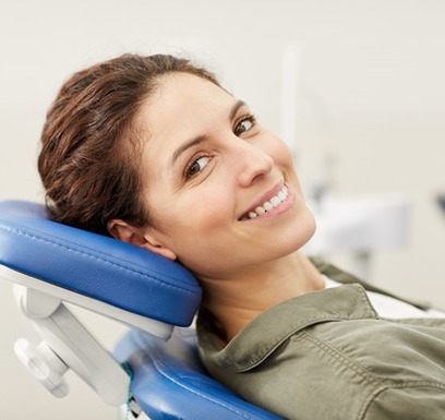 a patient smiling after undergoing dental treatment