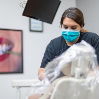 Dental team member treating dental patient in Tulsa