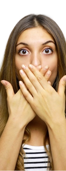 Woman covering her mouth before gum disease treatment