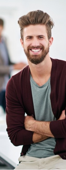 Man with straight smile after orthodontic treatment