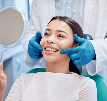 a patient smiling after visiting her United Healthcare dentist 